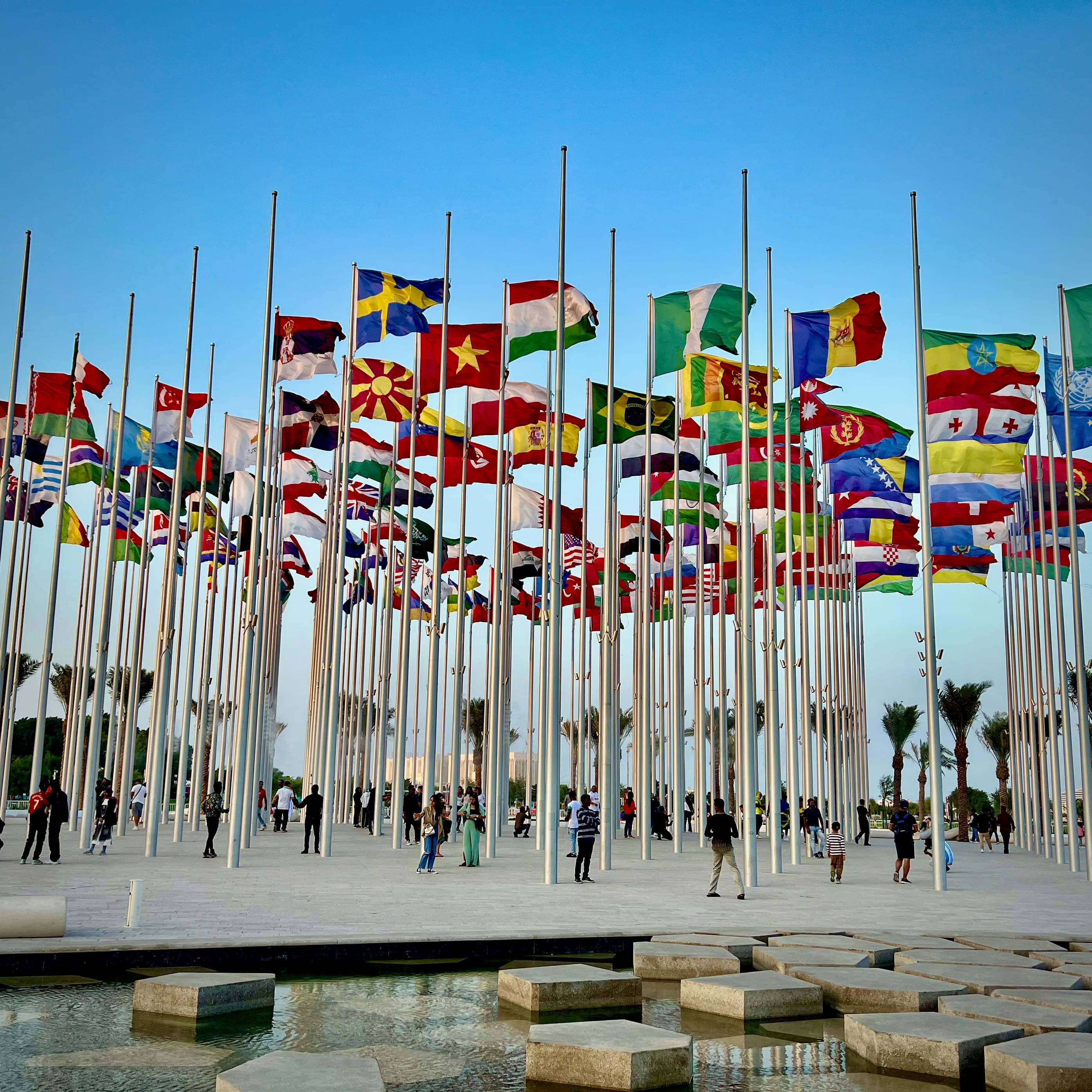 Flags from around the world lining a plaza